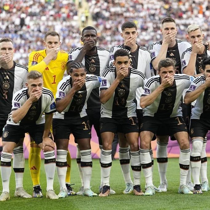 Germany players cover mouths at World Cup in FIFA protest